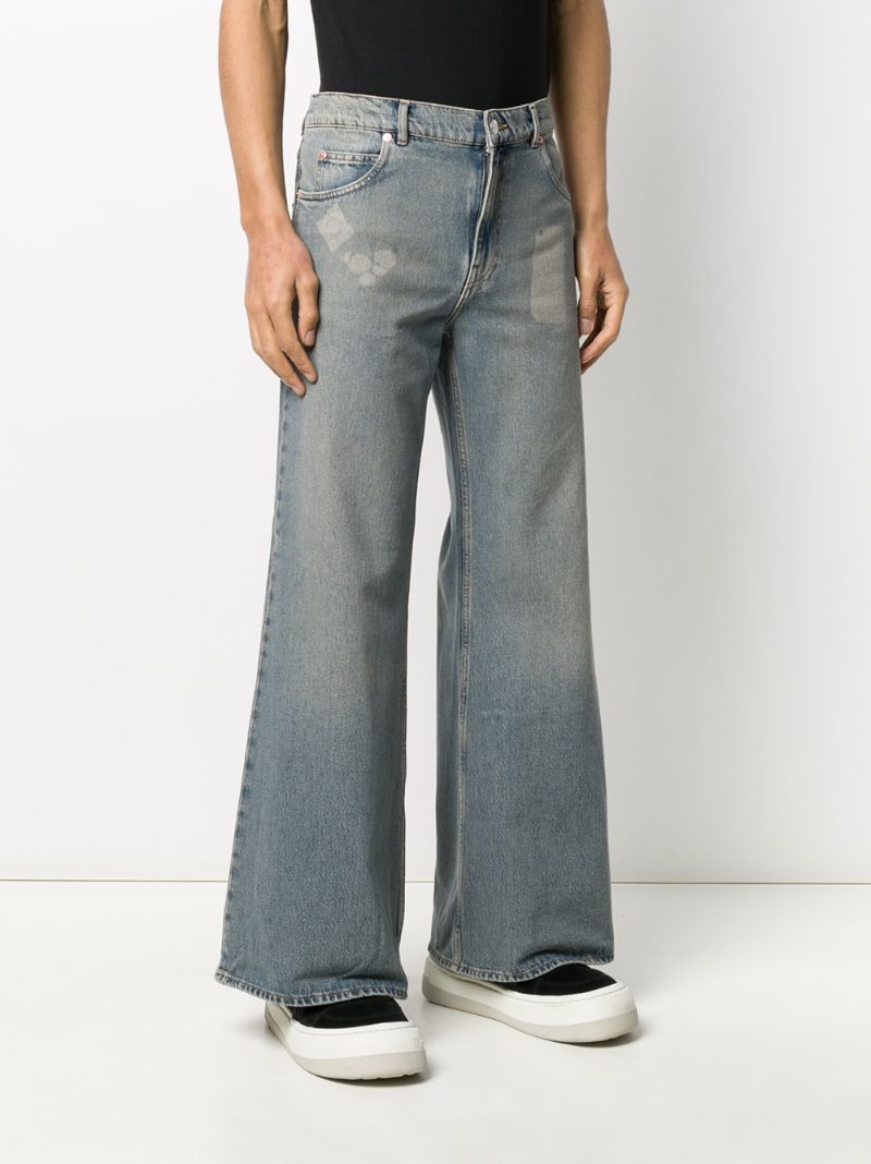 Shop Martine Rose Flared Stonewashed Jeans In Blue