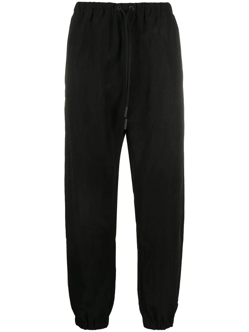 Click to view more detailed imagery on our partner's website Marcelo Burlon County Of Milan Logo Patch Track Pants In Black