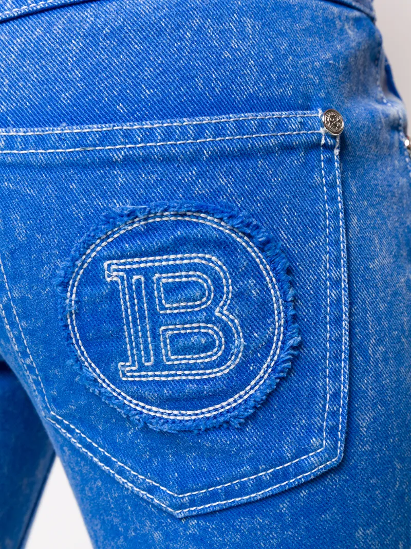 Shop Balmain Low Rise Flared Jeans In Blue