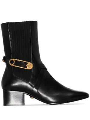 40mm Medusa safety pin-embellished ankle boots by Versace, available on farfetch.com for $1661 Jennifer Lopez Shoes SIMILAR PRODUCT