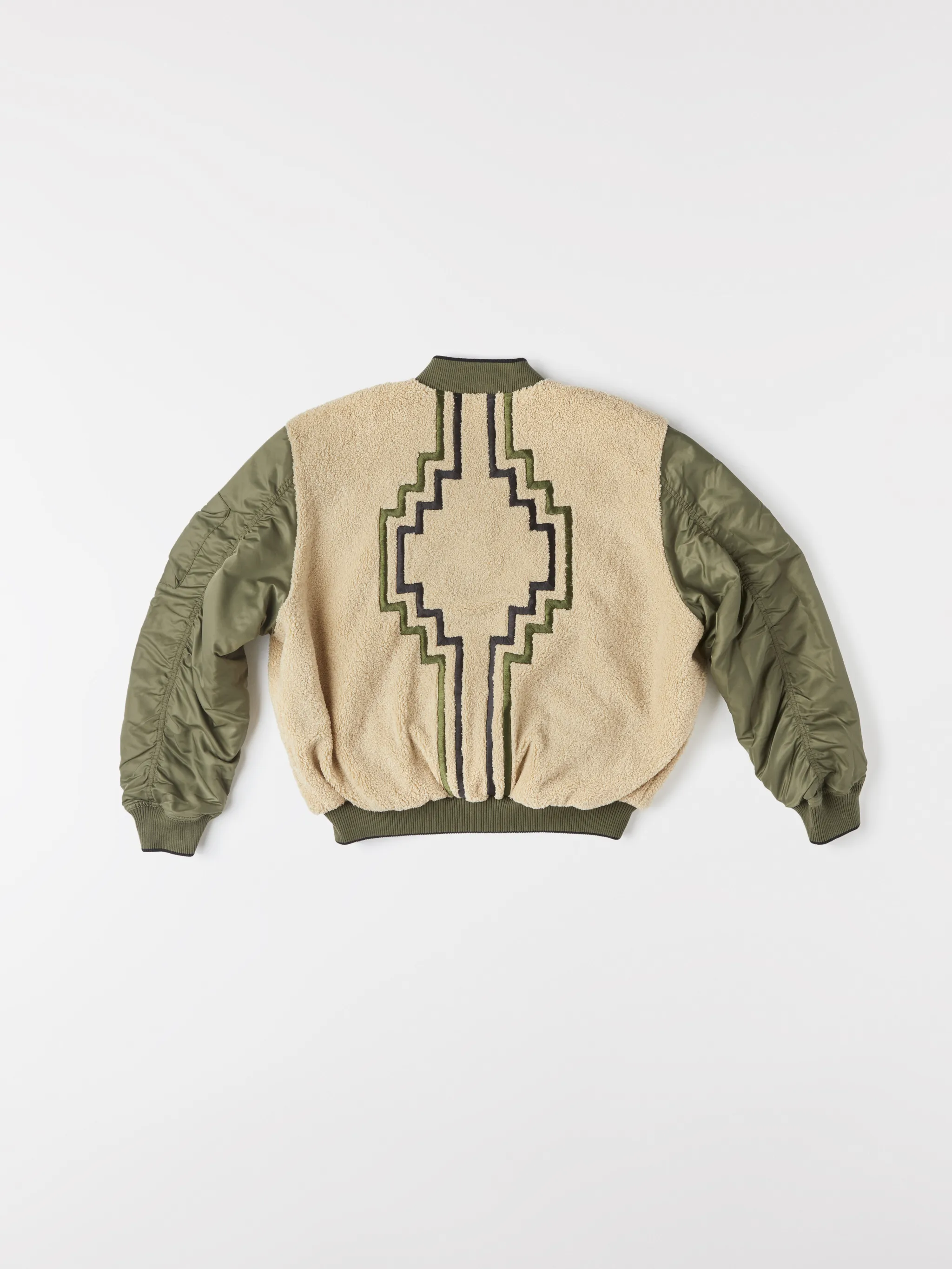 Army green/beige/black reversible panelled bomber jacket from Marcelo Burlon County of Milan featuring reversible, panelled design, embroidered logo to the rear, embroidered logo at the chest, ruched detailing, long sleeves, front zip fastening, two side slit pockets and ribbed edge.