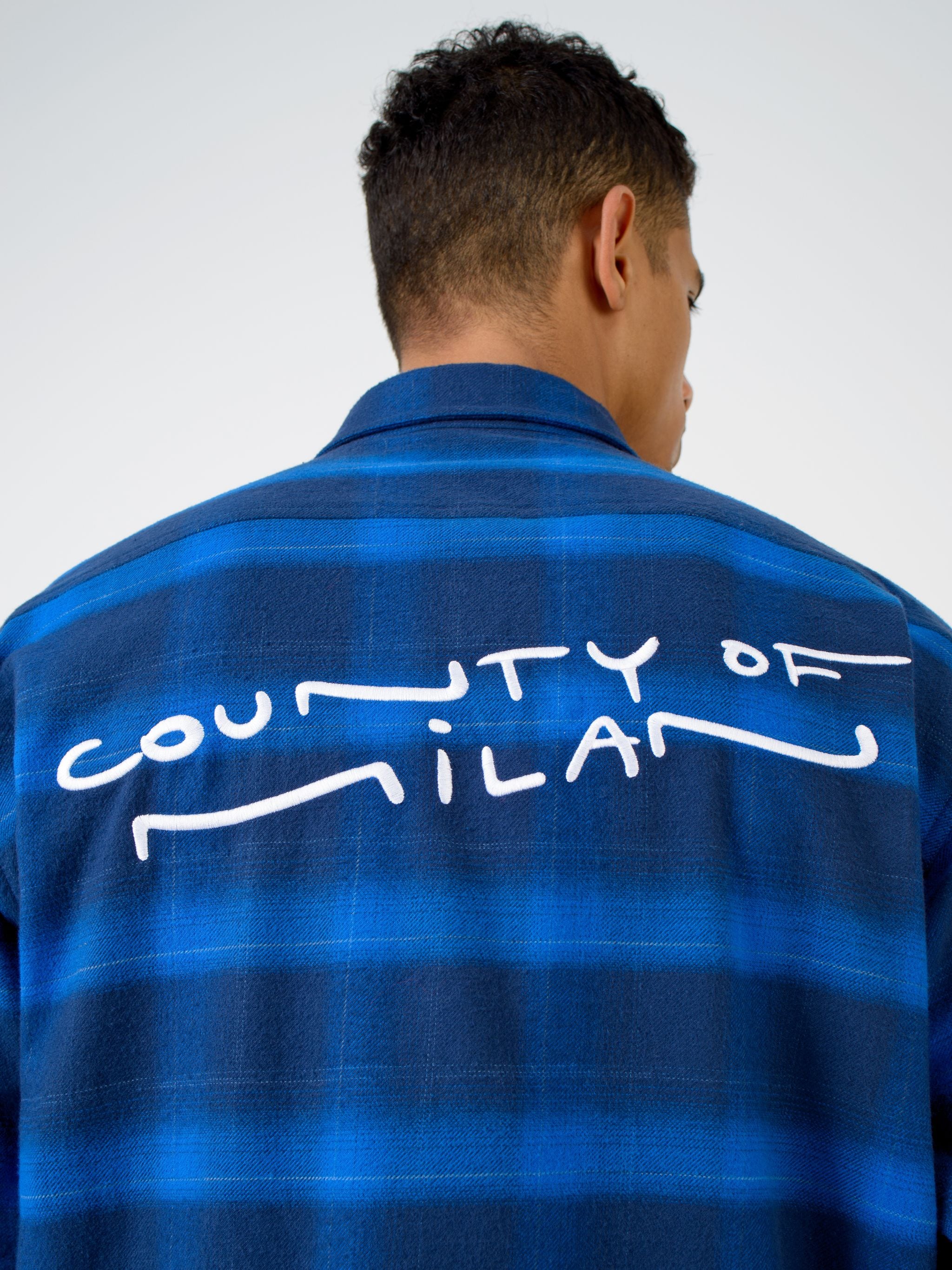 Blue/black cotton logo-print check-pattern shirt from Marcelo Burlon County of Milan featuring check pattern, logo print to the rear, classic collar, front button fastening, long sleeves, two chest flap pockets, buttoned cuffs and straight hem.