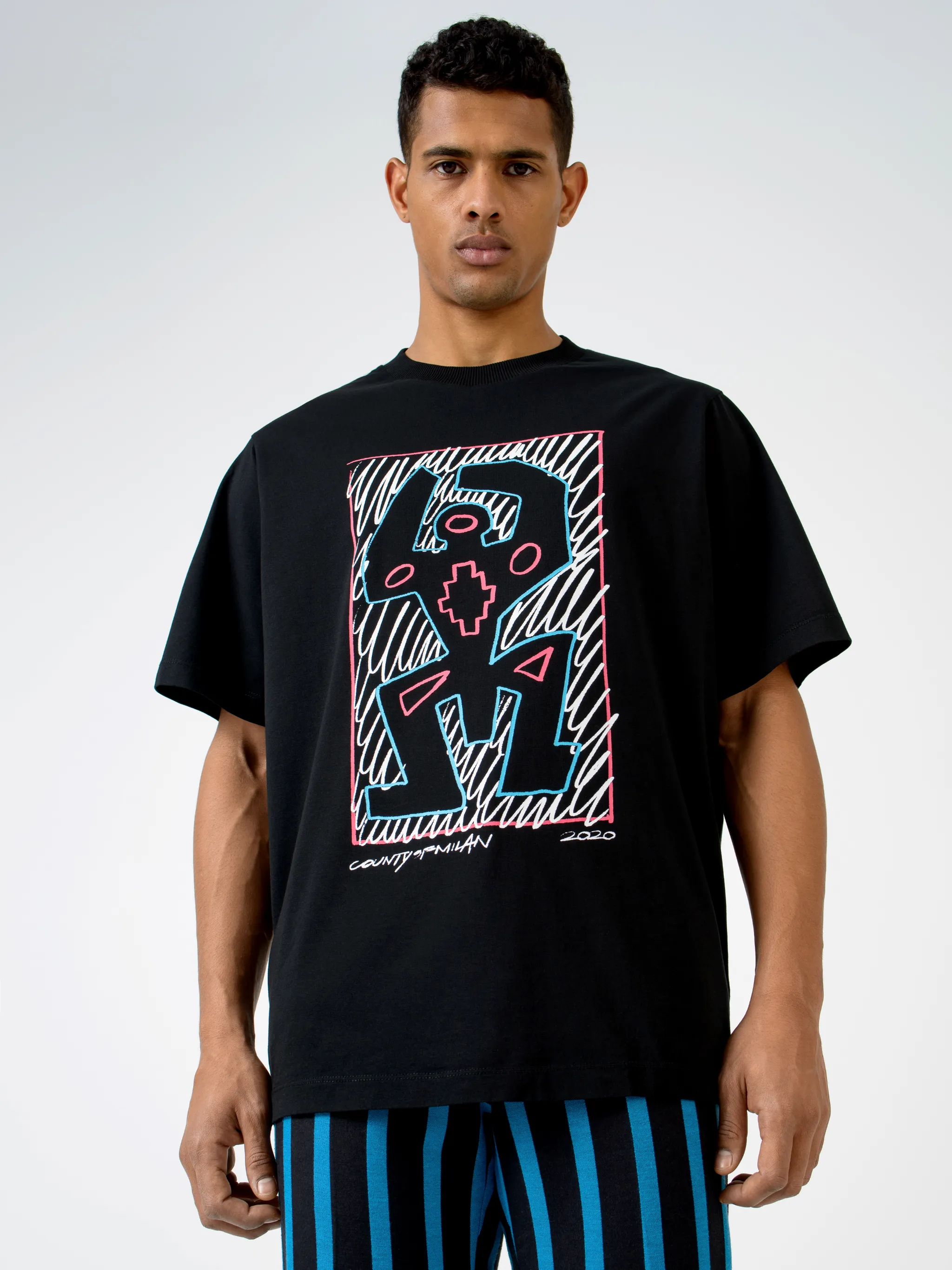 Black/multicolour graphic print cotton T-shirt from Marcelo Burlon County of Milan featuring graphic print, round neck, short sleeves and straight hem.