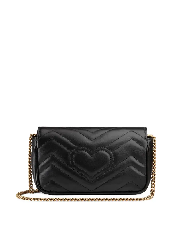 black gucci bag with heart on back