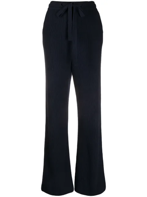 Shop Nanushka ribbed knit trousers with 