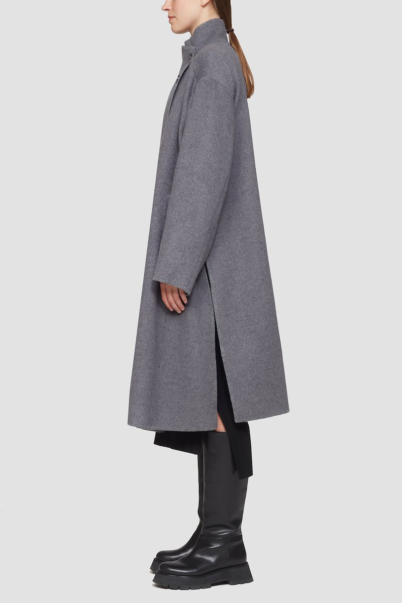 Melton Wool Blend Blanket Coat-grey #0 Melton Wool Blend Blanket Coat, Charcoal grey recycled wool-Tencel™ blend wrap blanket coat from 3.1 PHILLIP LIM featuring high neck, off-centre front button fastening, patch detail, drop shoulder, long sleeves, side slits, central rear vent and oversized style. POSITIVELY CONSCIOUS: At least 50% of the main material of this product meets our conscious criteria. For example, it's either organic, recycled, upcycled or independently recognised as being better for the environment (such as linen, ramie, TENCEL™ etc.)..- 4