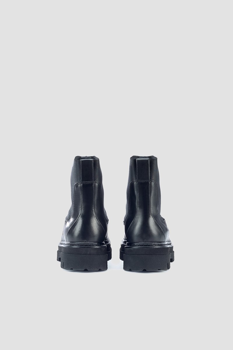 Sam Lug Sole Combat Boot-black #0 Sam Lug Sole Combat Boot, Black leather/patent leather Sam lug sole combat boots from 3.1 PHILLIP LIM featuring almond toe, tonal stitching, elasticated side panels, branded insole, pull-tab at the heel, low heel and chunky rubber sole.- 2