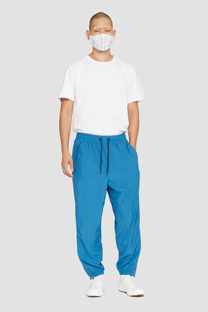 The Track-Less Pant-blue #0 The Track-Less Pant, Peacock blue Track-Less pants from 3.1 PHILLIP LIM featuring tapered leg, zip details, elasticated drawstring waistband, two side slit pockets, rear welt pocket and elasticated ankles.- 0