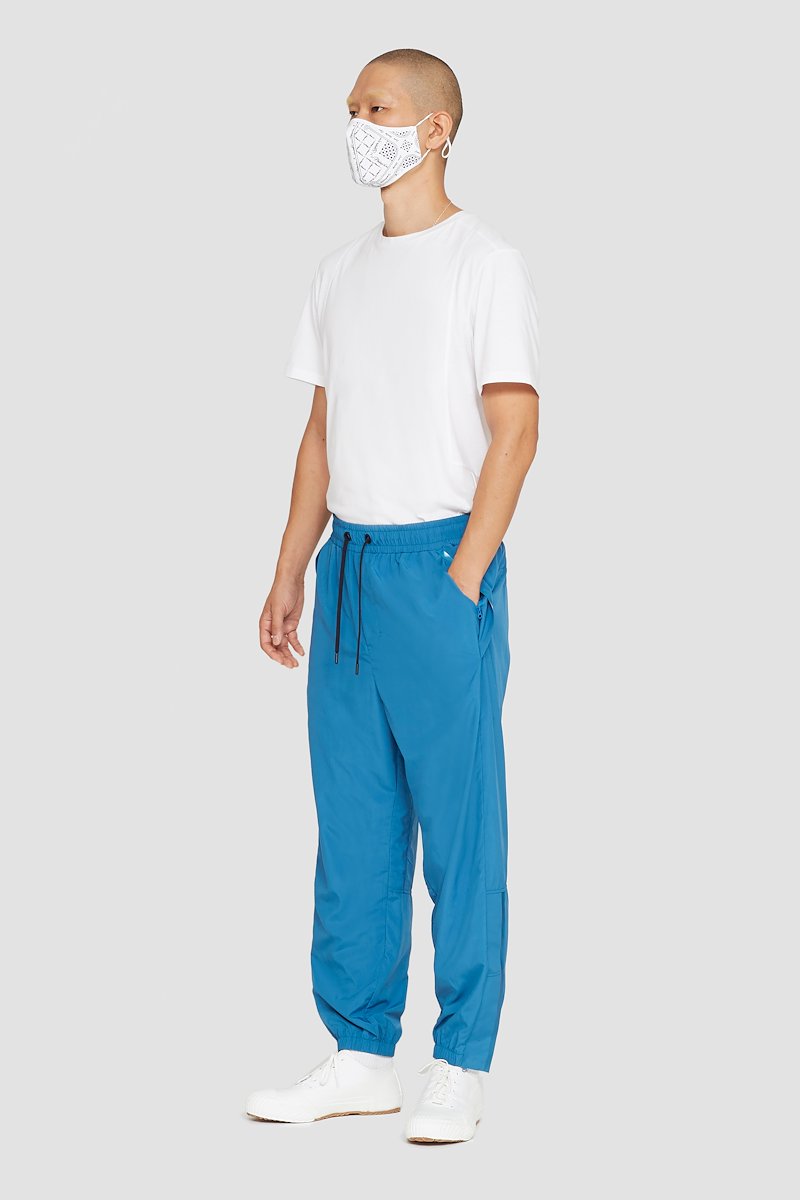 The Track-Less Pant-blue #1 The Track-Less Pant, Peacock blue Track-Less pants from 3.1 PHILLIP LIM featuring tapered leg, zip details, elasticated drawstring waistband, two side slit pockets, rear welt pocket and elasticated ankles.- 1