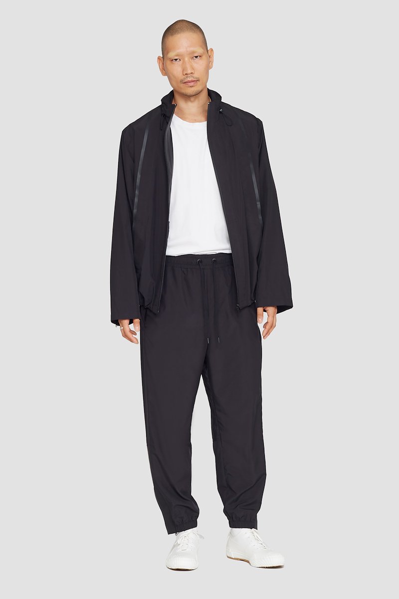 The Win-Breaker-black #1 The Win-Breaker, Black drawstring-fastening jacket from 3.1 PHILLIP LIM featuring drawstring hem, cuff zips, drawstring neck, stand-up collar, long sleeves, front zip fastening and two zip-fastening pockets.- 3