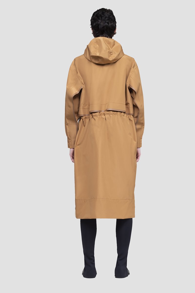 The Essential Parka-neutrals #0 The Essential Parka, Camel brown Essential hooded parka coat from 3.1 PHILLIP LIM featuring water-resistant, wind-resistant, storm flap, drawstring hood, stand-up collar, long sleeves, drawstring waist, concealed front button fastening and FUZE BIOTECH technology.- 2