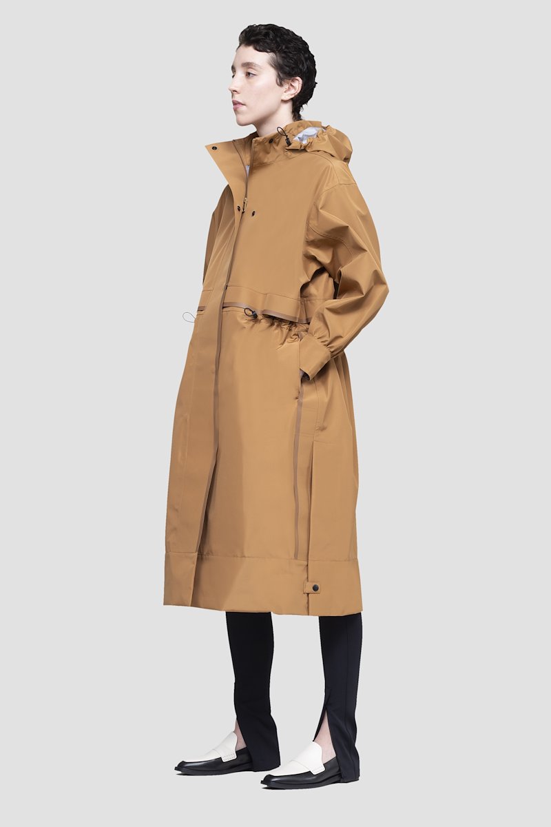 The Essential Parka-neutrals #1 The Essential Parka, Camel brown Essential hooded parka coat from 3.1 PHILLIP LIM featuring water-resistant, wind-resistant, storm flap, drawstring hood, stand-up collar, long sleeves, drawstring waist, concealed front button fastening and FUZE BIOTECH technology.- 1