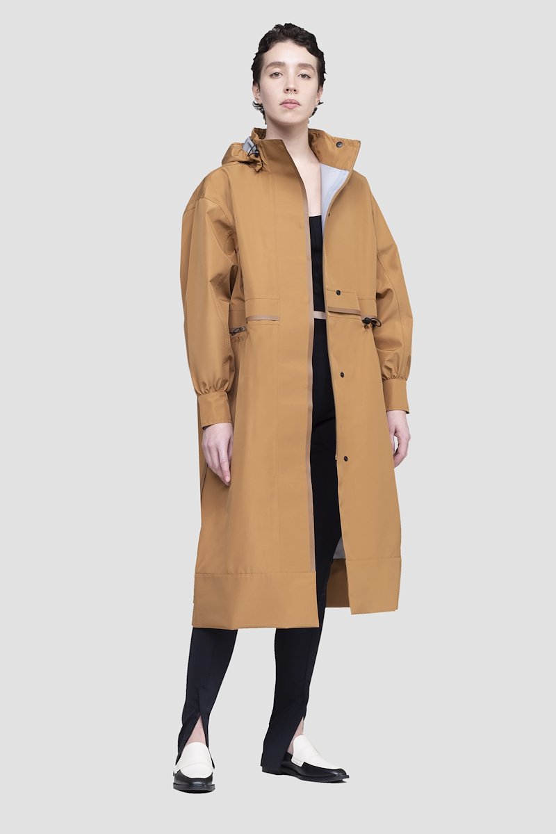 The Essential Parka-neutrals #1 The Essential Parka, Camel brown Essential hooded parka coat from 3.1 PHILLIP LIM featuring water-resistant, wind-resistant, storm flap, drawstring hood, stand-up collar, long sleeves, drawstring waist, concealed front button fastening and FUZE BIOTECH technology.- 3