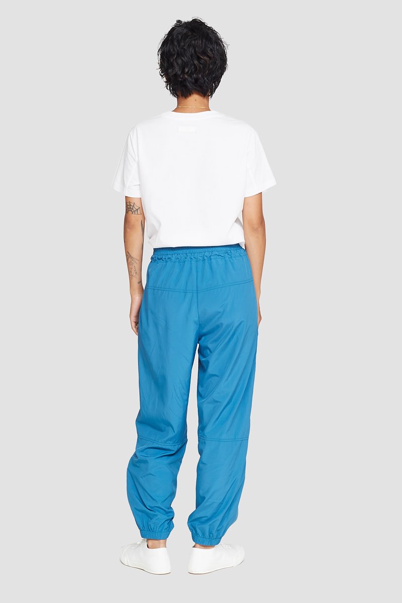 The Track-Less Pant-blue #0 The Track-Less Pant, Peacock blue Track-less cropped track pants from 3.1 PHILLIP LIM featuring mid-rise, elasticated drawstring waistband, two side slit pockets and elasticated cuffs.- 2