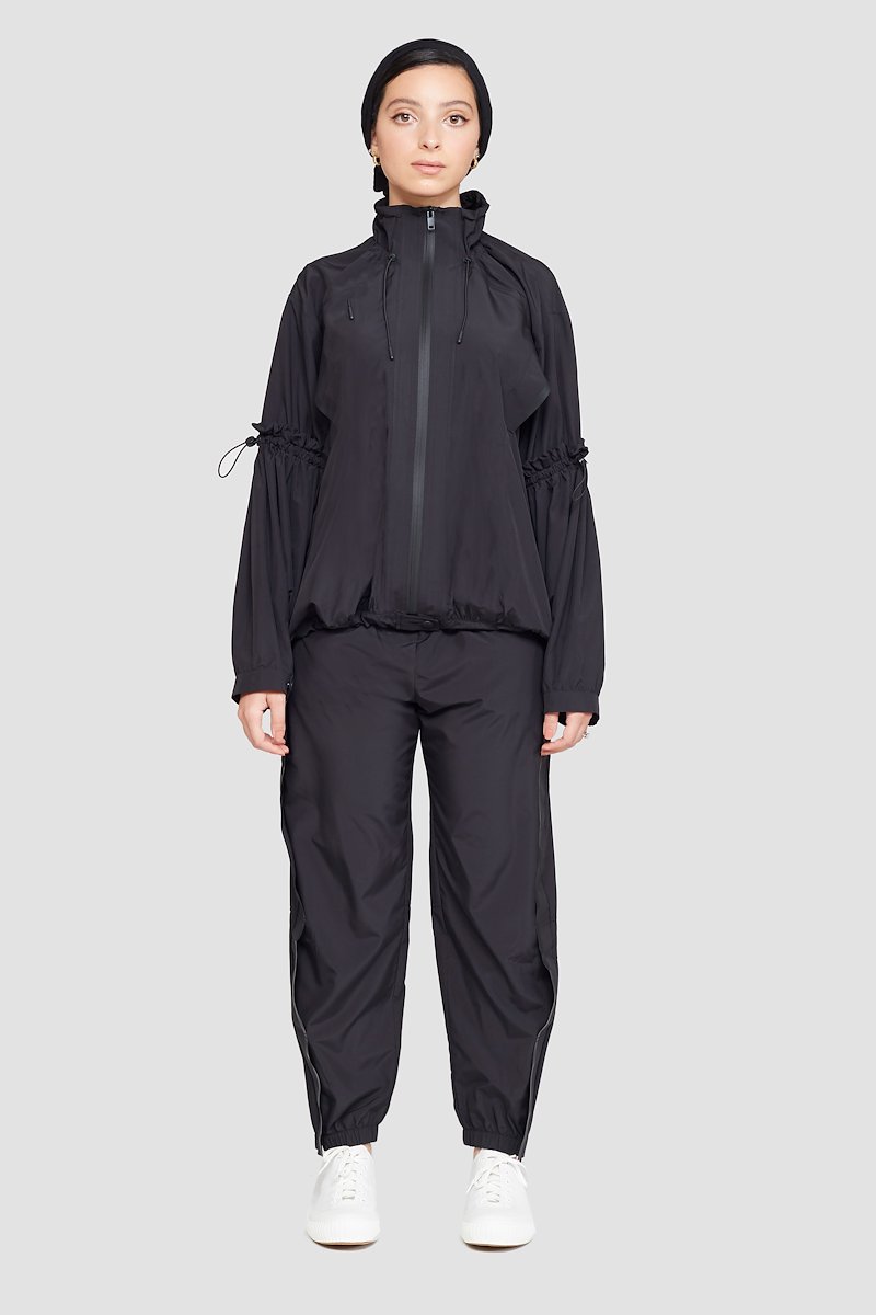 The Win-Breaker-black #0 The Win-Breaker, Black drawstring-detail jacket from 3.1 PHILLIP LIM featuring drawstring fastening, two slit pockets at the chest, buttoned-cuff sleeves, front zip fastening and long sleeves.- 0
