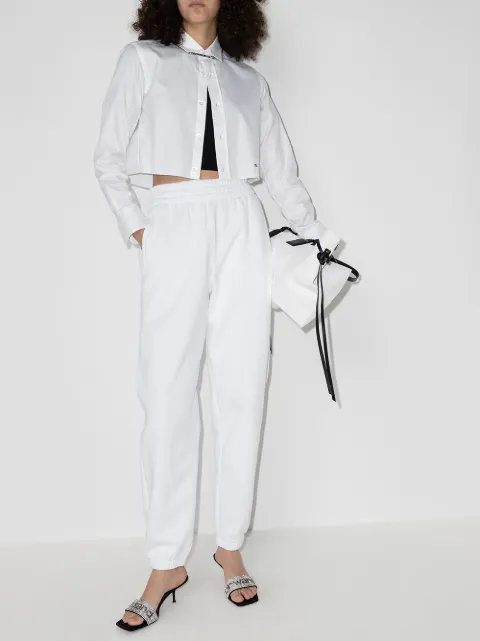 Shop white Alexander Wang logo print loose-fit track pants with Express Delivery - Farfetch