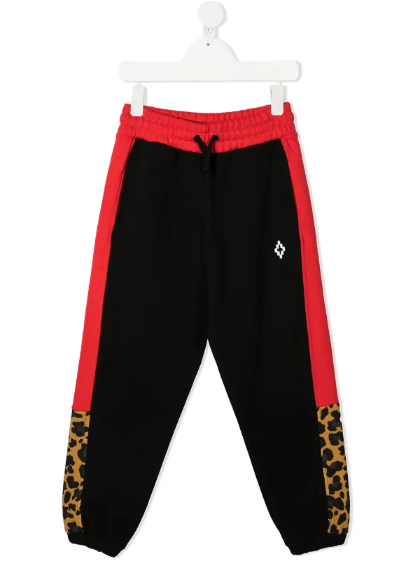 red and black tracksuit bottoms