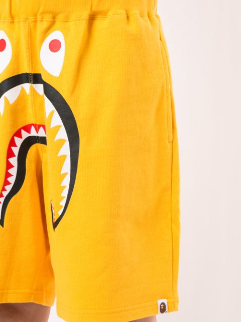 Shop yellow A BATHING APE® Shark wide track shorts with Express ...