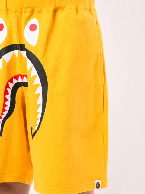 Shop yellow A BATHING APE® Shark wide track shorts with Express ...