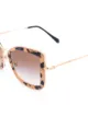 Miu Miu Eyewear نظارة شمس بإطار كبير