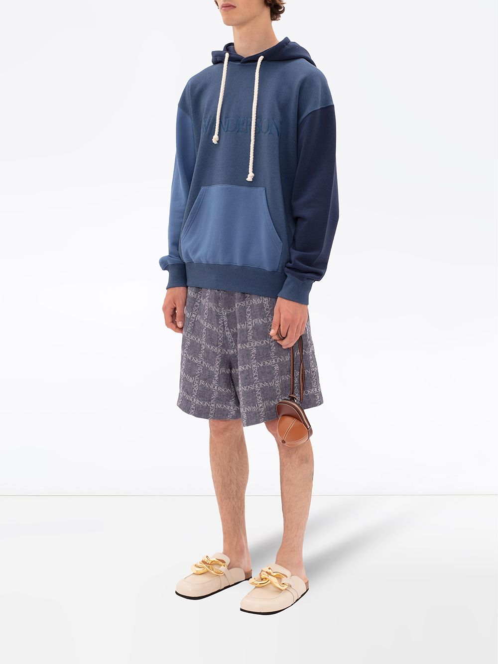 Shop Jw Anderson All-over Logo Print Shorts In Blue
