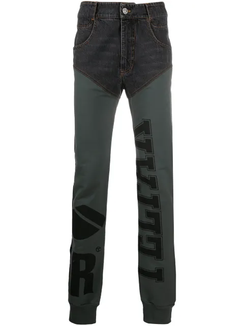Telfar panelled logo-print trousers