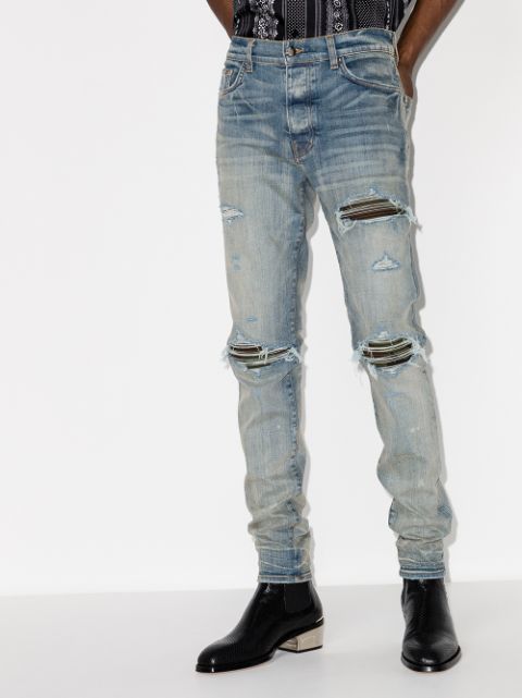 Shop AMIRI ripped distressed skinny jeans with Express Delivery - FARFETCH