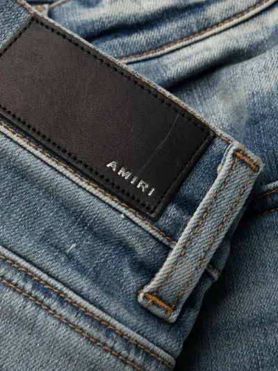 ripped distressed skinny jeans | AMIRI 