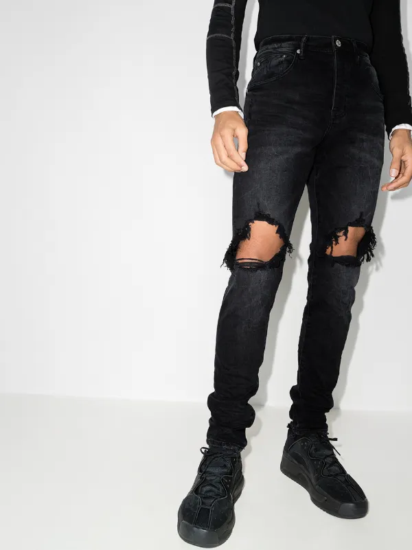 low-rise "Black Wash Blowout" slim jeans