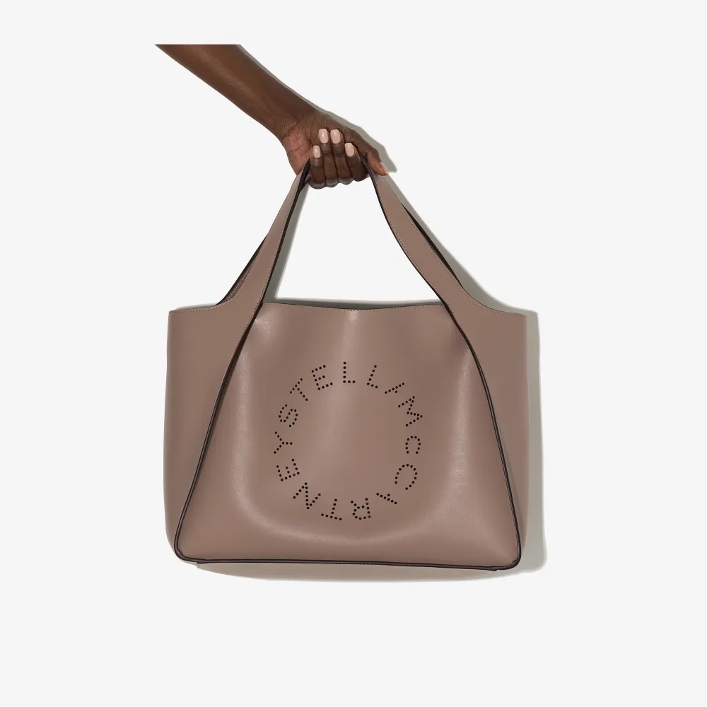 Click to view more detailed imagery on our partner's website Stella Mccartney Beige Perforated Logo Faux Leather Tote Bag In Pink