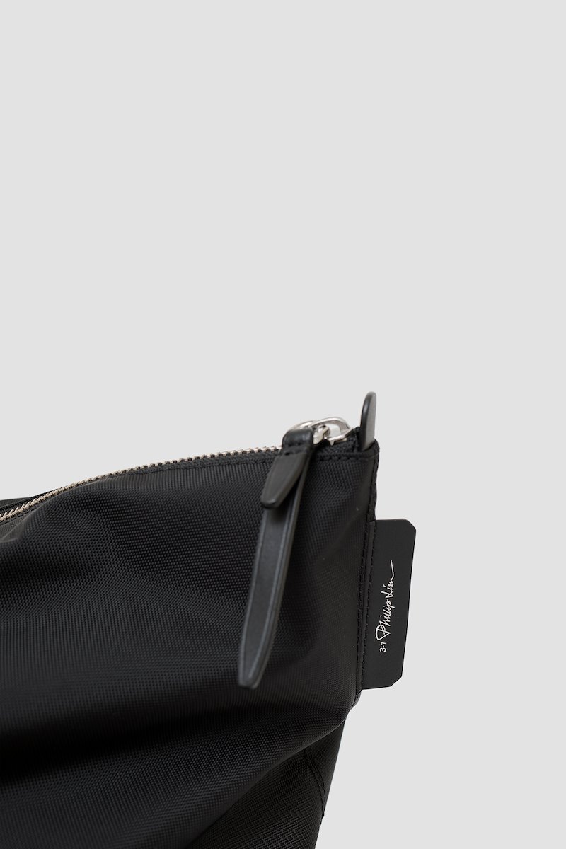 The Deconstructed Duffle Bag-black #1 The Deconstructed Duffle Bag, Black Deconstructed duffle bag from 3.1 PHILLIP LIM featuring leather trim, two top handles, two long top handles and top zip fastening.- 3