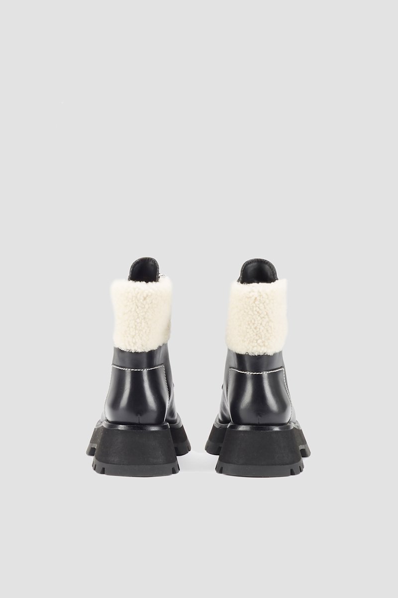 Kate Lug Sole Double Zip Shearling Boot-black #0 Kate Lug Sole Double Zip Shearling Boot, Black leather Kate shearling-trimmed ankle boots from 3.1 PHILLIP LIM featuring shearling trim, contrast stitching, front lace-up fastening, ridged rubber sole, almond toe and short side zip fastening.- 2