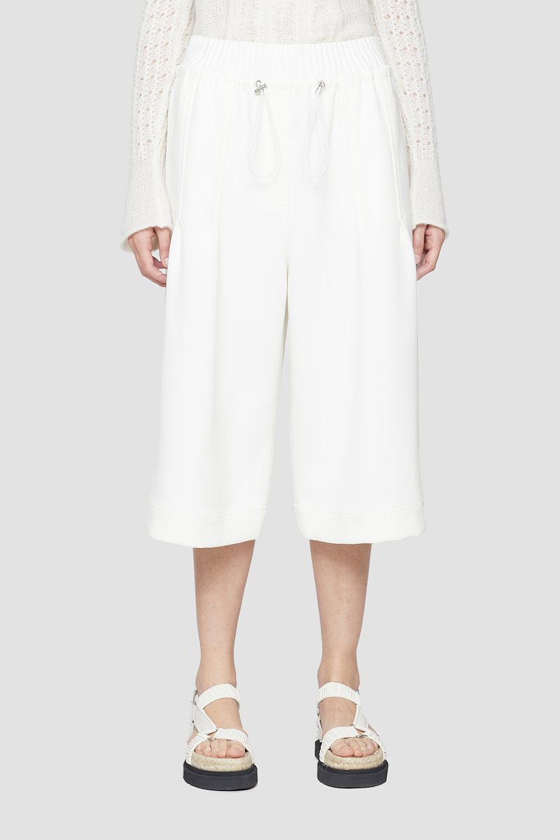 Twill Culotte-white #0 Twill Culotte, White high-rise cropped trousers from 3.1 PHILLIP LIM featuring box-pleat detail, high waist, elasticated waistband, drawstring waist, two side slit pockets, two rear flap pockets, wide leg and cropped leg.- 0