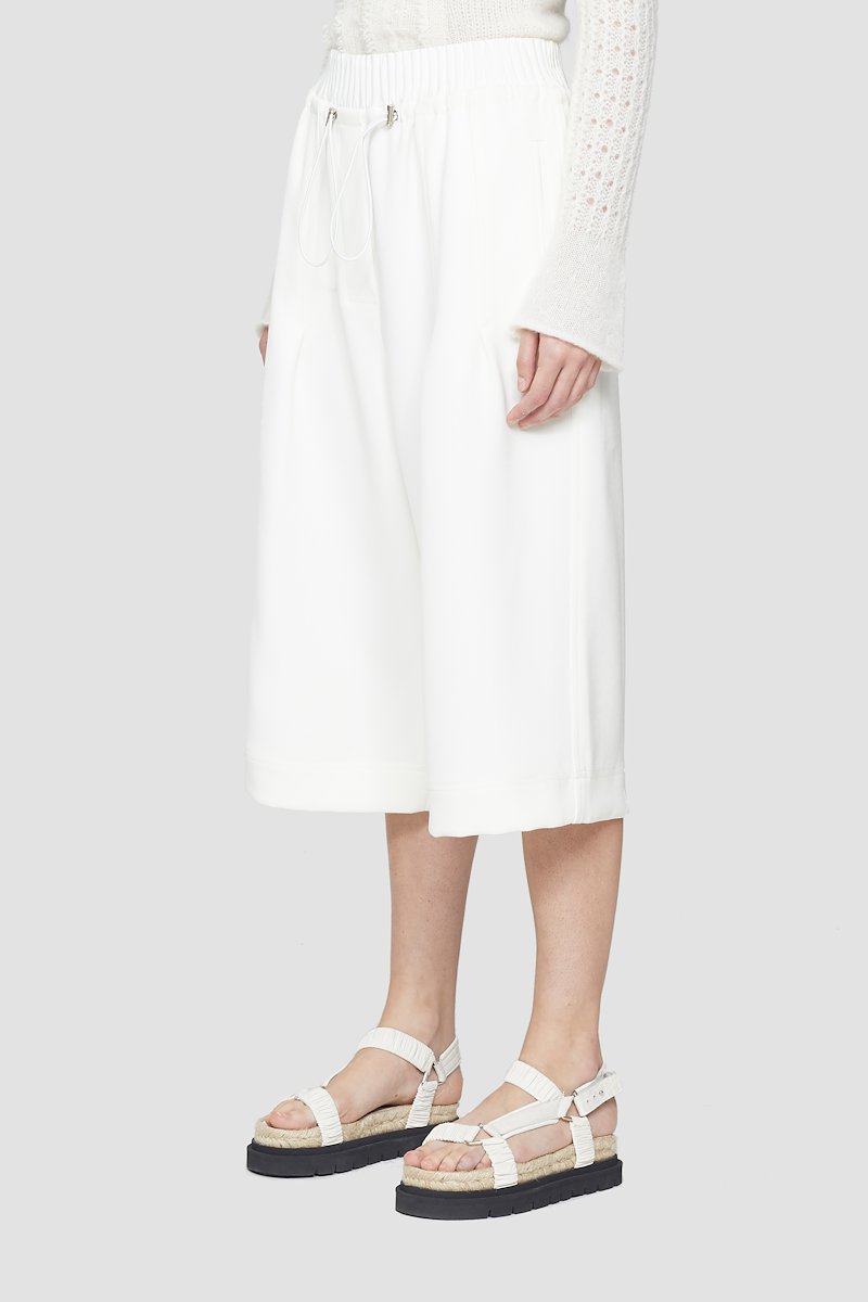 Twill Culotte-white #1 Twill Culotte, White high-rise cropped trousers from 3.1 PHILLIP LIM featuring box-pleat detail, high waist, elasticated waistband, drawstring waist, two side slit pockets, two rear flap pockets, wide leg and cropped leg.- 1