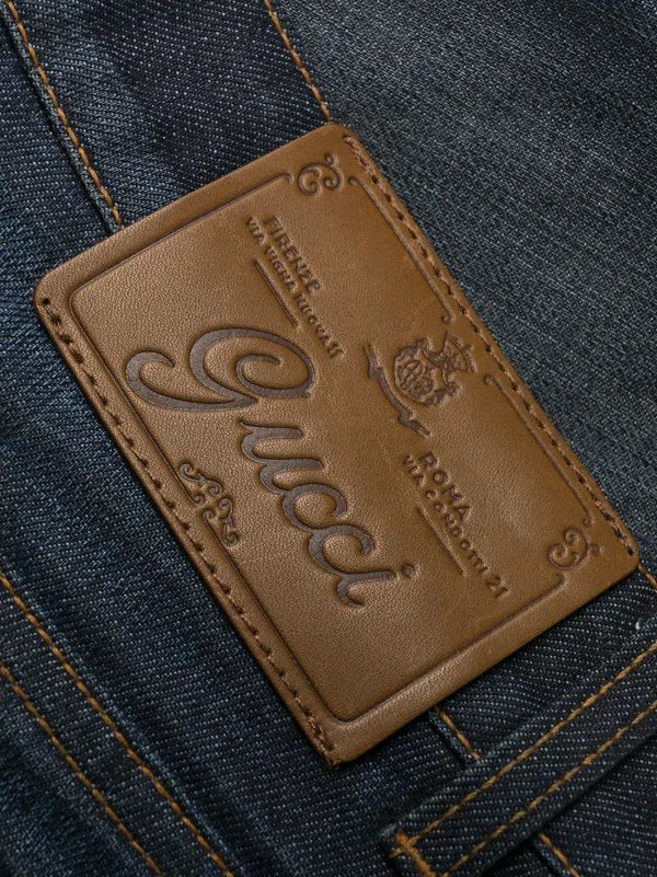 Gucci chain-detail Flared Jeans - Farfetch