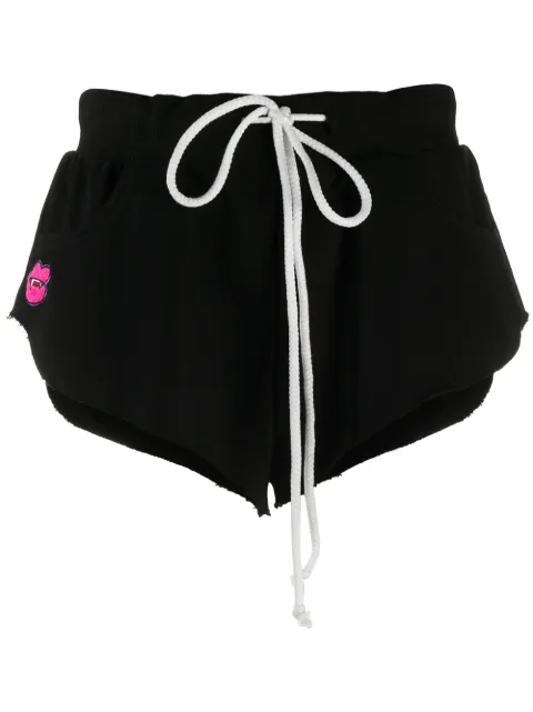 Natasha Zinko shorts con parche de colmillo