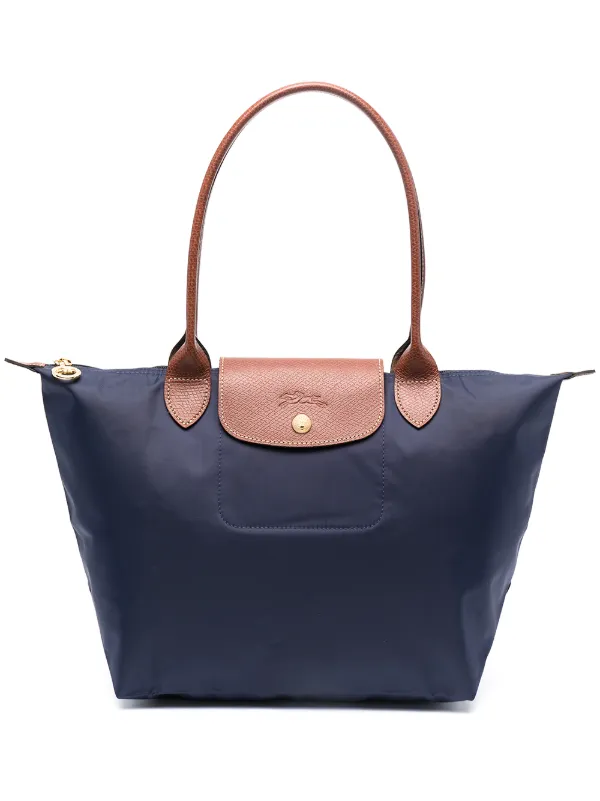 blue bolsa with brown handle