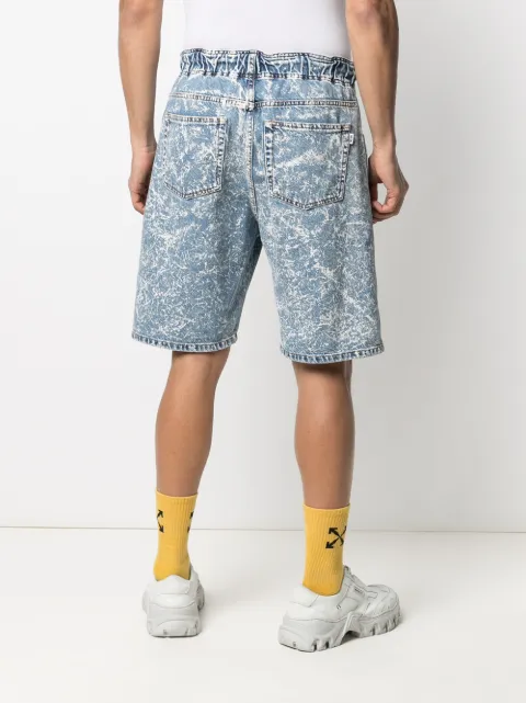 Shop MSGM acid wash denim shorts with 