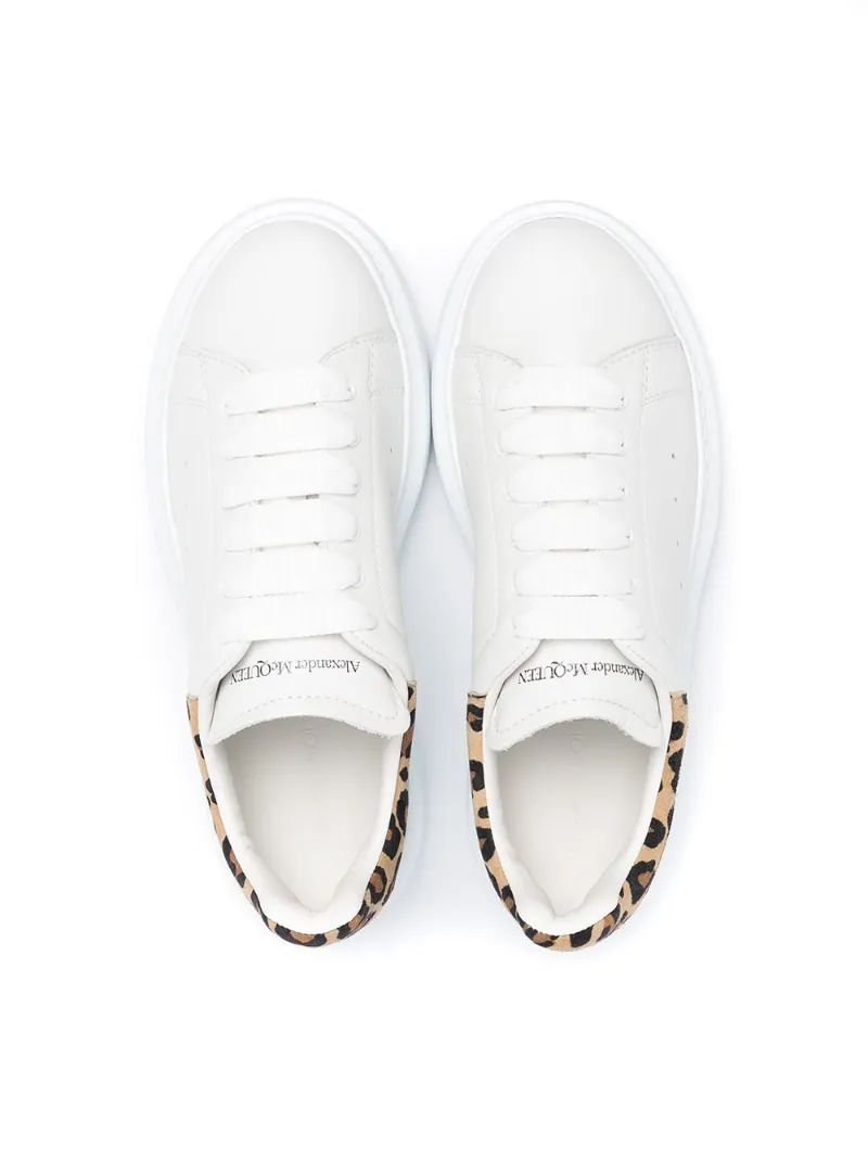 white sneakers with leopard back