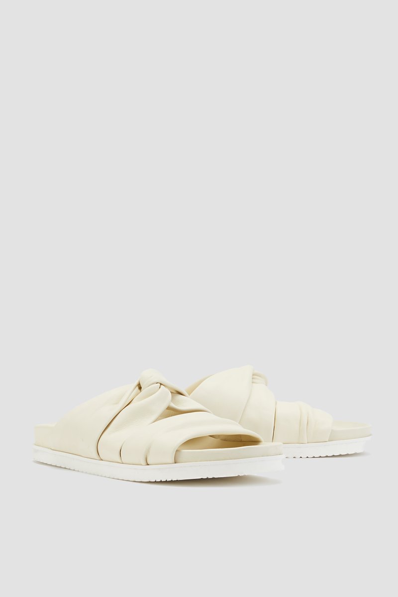 Twisted Pool Slide-neutrals #1 Twisted Pool Slide, Vanilla nude calf leather twist-detail leather slides from 3.1 PHILLIP LIM featuring leather lining, twist detailing, open toe, slip-on style, branded insole and flat rubber sole.- 3