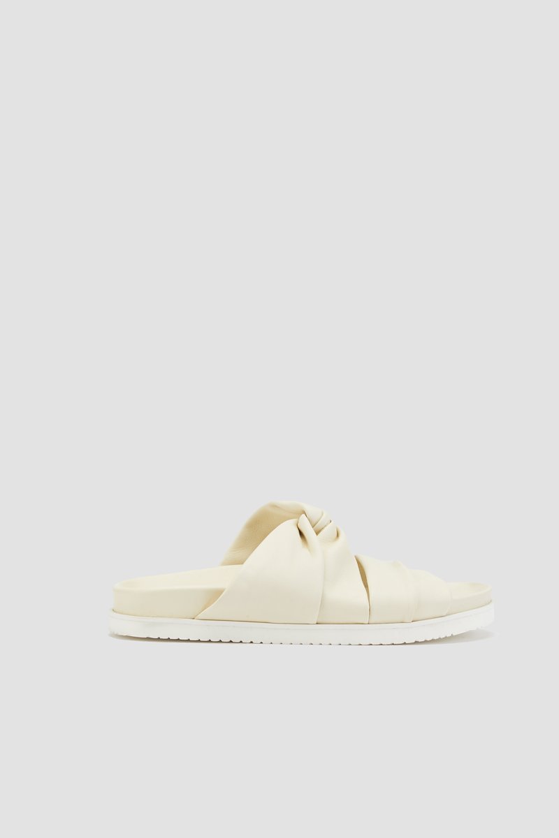 Twisted Pool Slide-neutrals #0 Twisted Pool Slide, Vanilla nude calf leather twist-detail leather slides from 3.1 PHILLIP LIM featuring leather lining, twist detailing, open toe, slip-on style, branded insole and flat rubber sole.- 0