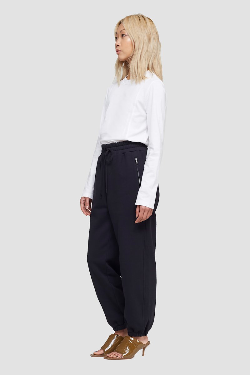 The Everyday Sweatpant-black #0 The Everyday Sweatpant, Black cotton drawstring-waist track pants from 3.1 PHILLIP LIM featuring jersey fleece, logo patch to the side, elasticated ankles, elasticated drawstring waistband and two side zip-fastening pockets.- 2