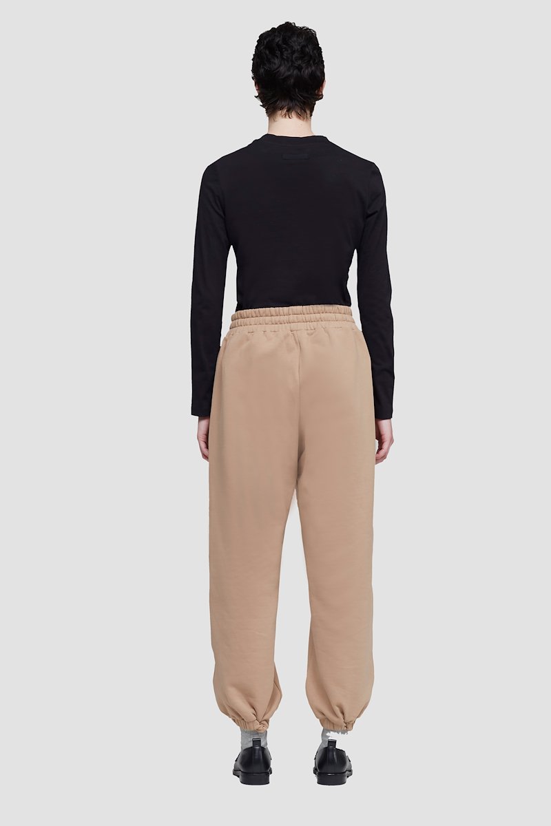 The Everyday Sweatpant-neutrals #1 The Everyday Sweatpant, Beige cotton drawstring-waist track pants from 3.1 PHILLIP LIM featuring jersey fleece, logo patch to the side, elasticated ankles, elasticated drawstring waistband and two side zip-fastening pockets.- 5