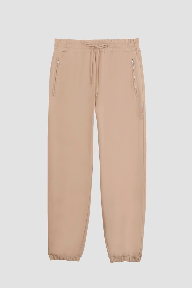The Everyday Sweatpant-neutrals #1 The Everyday Sweatpant, Beige cotton drawstring-waist track pants from 3.1 PHILLIP LIM featuring jersey fleece, logo patch to the side, elasticated ankles, elasticated drawstring waistband and two side zip-fastening pockets.- 7