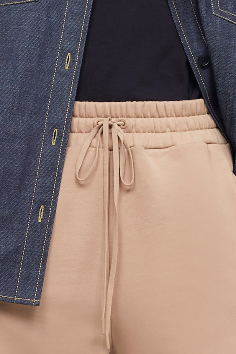 The Everyday Sweatpant-neutrals #0 The Everyday Sweatpant, Beige cotton drawstring-waist track pants from 3.1 PHILLIP LIM featuring jersey fleece, logo patch to the side, elasticated ankles, elasticated drawstring waistband and two side zip-fastening pockets.- 6