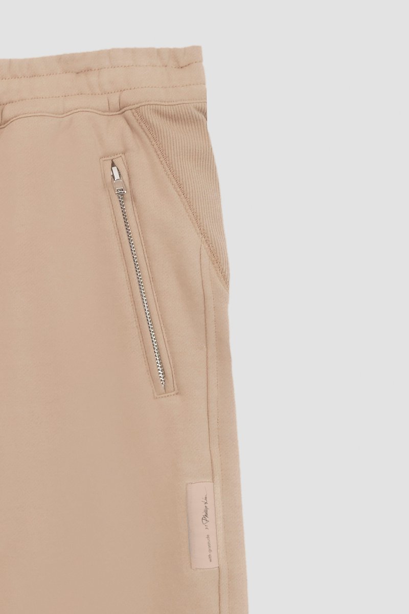 The Everyday Sweatpant-neutrals #1 The Everyday Sweatpant, Beige cotton drawstring-waist track pants from 3.1 PHILLIP LIM featuring jersey fleece, logo patch to the side, elasticated ankles, elasticated drawstring waistband and two side zip-fastening pockets.- 9