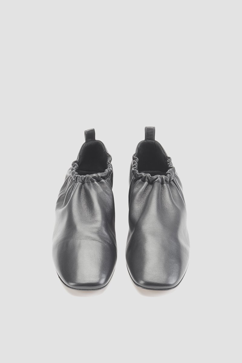 Ruched Slipper-black #1 Ruched Slipper, Did you know that in the16th century, mules were bedroom or boudoir slippers worn inside and not out in public? Can you imagine not being allowed to show this 3.1 Phillip Lim silver-tone pair to everyone? Glad fashion evolved, right? Featuring a ruched detail, a pull tab at the rear, a square toe, an elasticated fastening and a flat leather sole.- 3