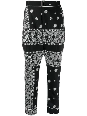 Sacai x Hank Willis Thomas Patchwork Trousers | Black | FARFETCH