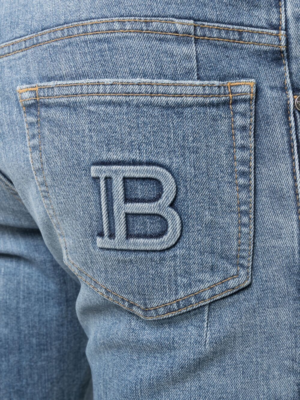 Shop Balmain Embossed-logo Tapered Jeans In Blue