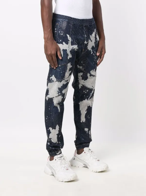 Shop Dsquared2 tie-dye tapered jeans 